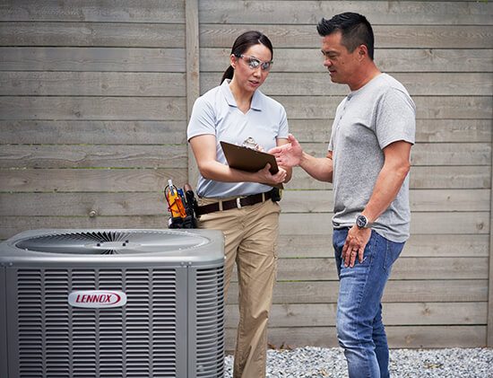 Lady showing man air conditioner